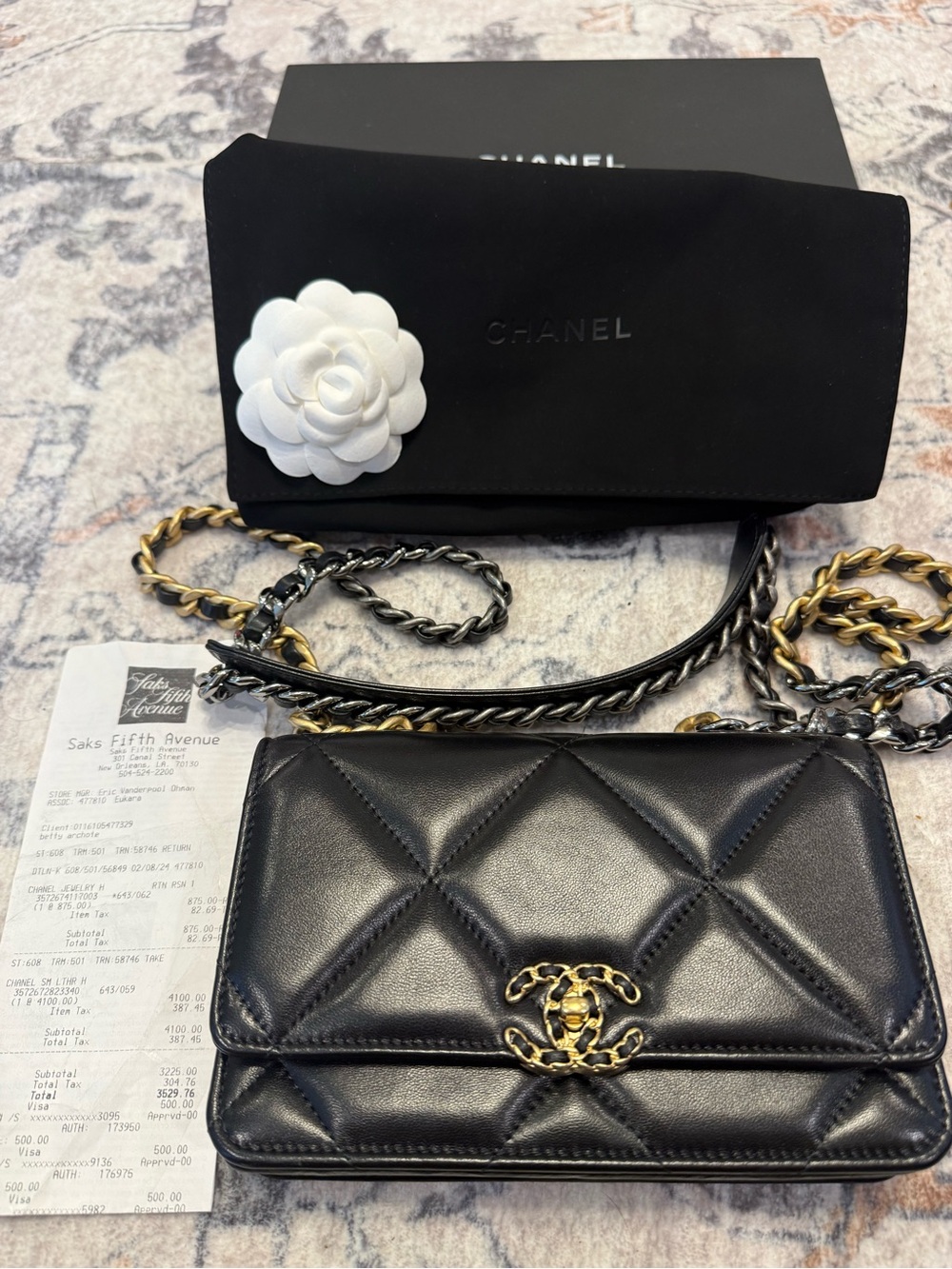 CHANEL Black Quilted Lambskin WOC with Gold-Tone CC Hardware